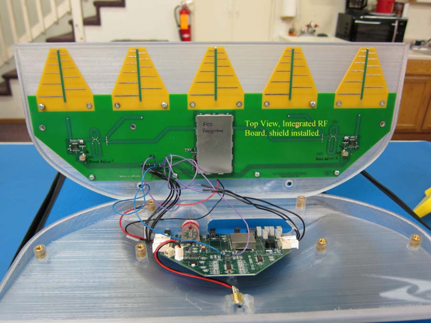 SubSurface Instruments' own FCC filing photograph of the AML opened up, showing five yellow Yagi antennas on the integrated RF board.