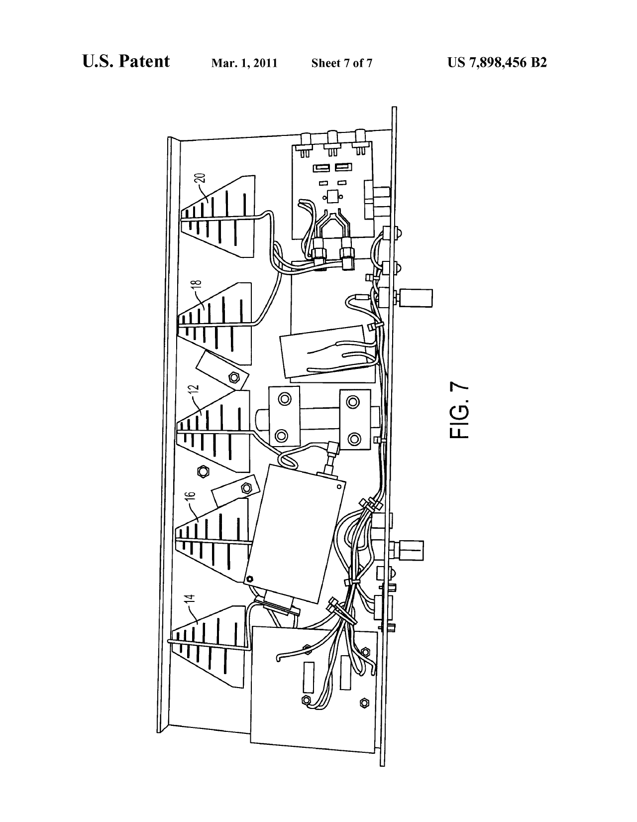 Patent figure 7: interior of the locator showing five plastic-embedded antennas and hand-wired boards